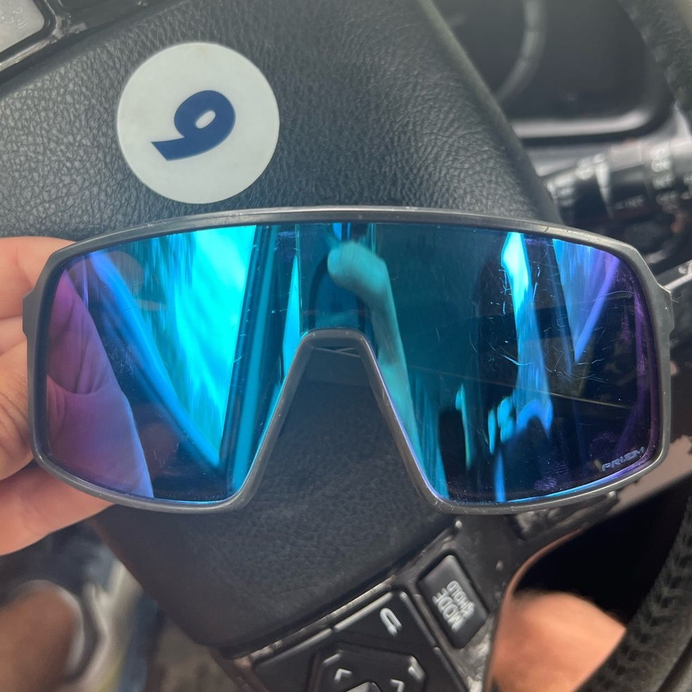 Black Oakley sunglasses.